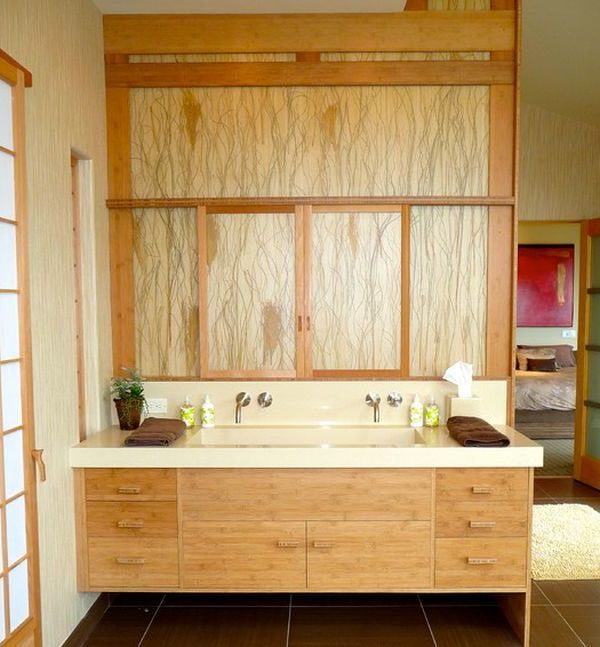 Artistic floating bathroom vanity draped extensively in light grain wood