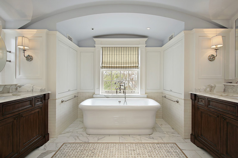 Bathroom with marble tiles using classical Roman architecture and Italian style bathtub