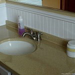 How to Cover Dated Bathroom Tile with Wainscoting