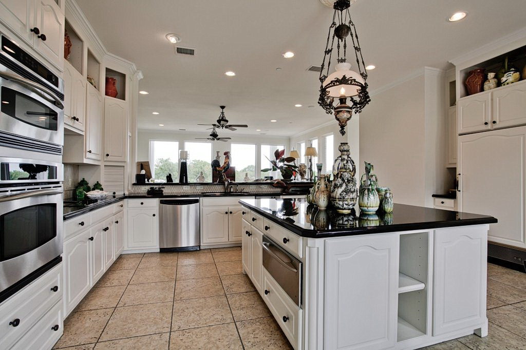 White Gloss Kitchens with black kitchen worktops