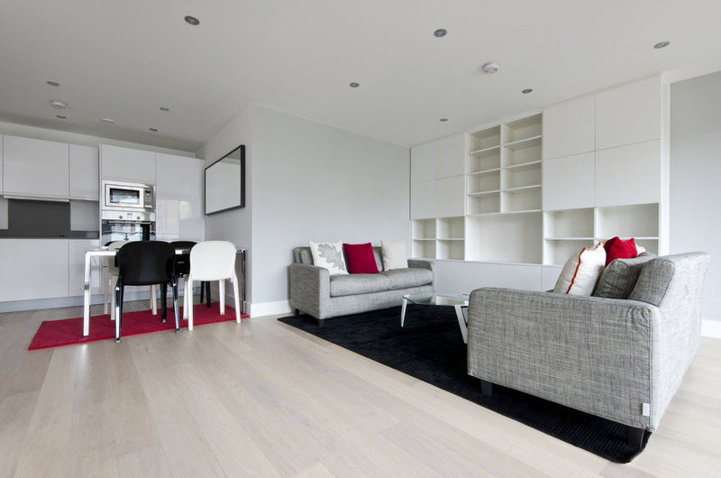 grey and beige living room red accents