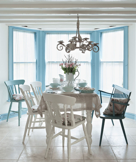 White kitchen with blue trimmed windows