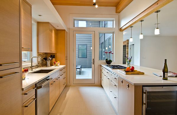 Modern galley kitchen with white countertop and beautiful backsplash