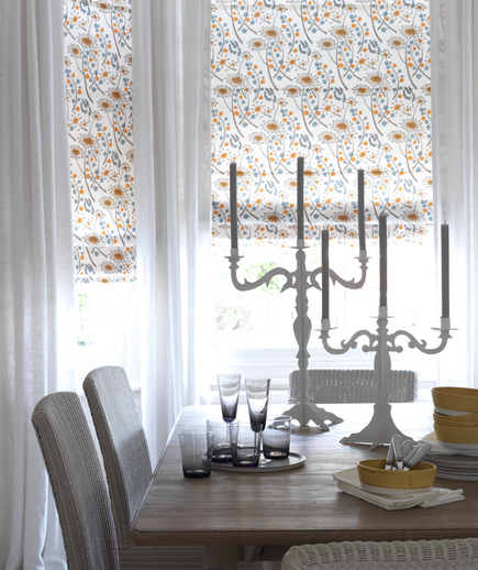 White room with patterned curtains