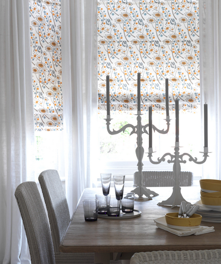 White room with patterned curtains White room with patterned curtains