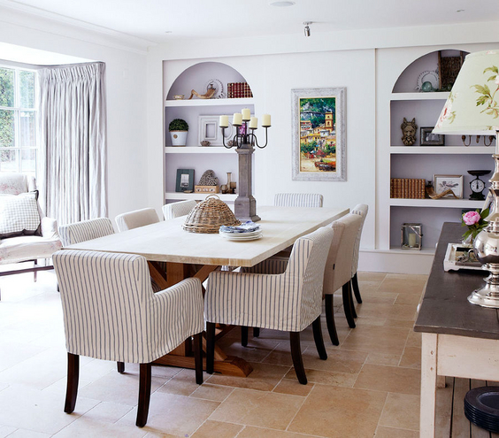 Large dining room with striped slip covers