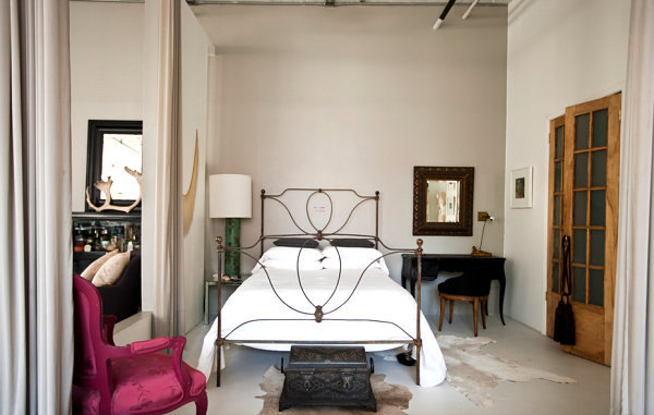 Pink chair adds a dash of color to this loft bedroom Pink chair adds a dash of color to this loft bedroom