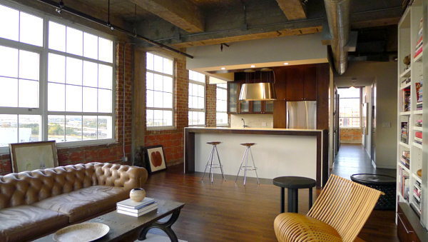 Industrial loft living room with a tufted sofa Industrial loft living room with a tufted sofa