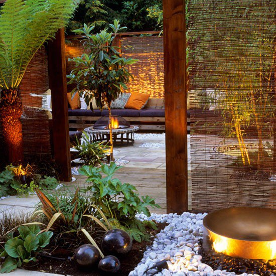 Exotic garden with fire pit, willow screens and decking