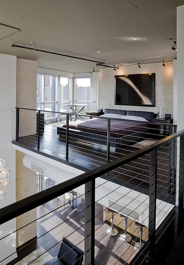 Fancy Inspirational Bedroom Area With Black Floors Is Open To The Atrium by FORMA Design.