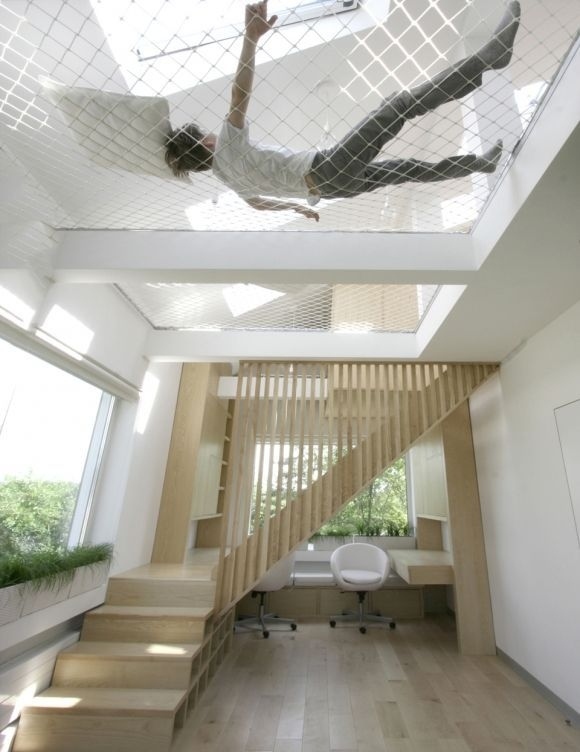 Have an extra-tall ceiling? Stretch a ceiling hammock across it.