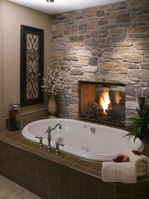 Install a two-sided fireplace between the bathroom and the bedroom.