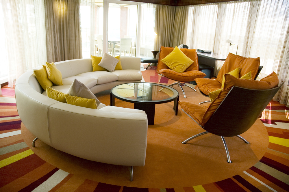 Circular living room features bright multicolored sun