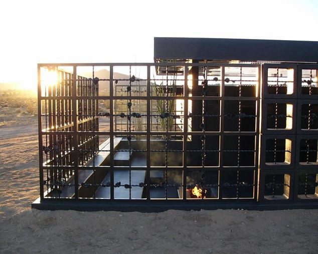 open concept desert hotel room all black What Happens When a Punk Rocker Designs a desert house?