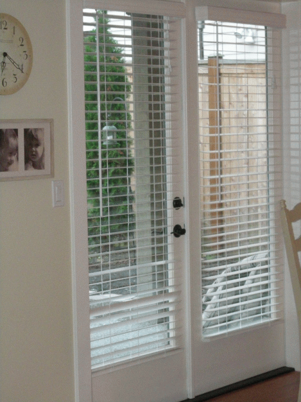 french doors with blinds inside