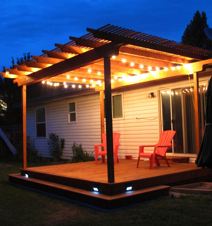 Awesome pergola deck with wrap around step and strand lighting. It ...