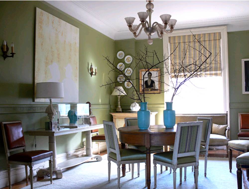 green dining room with gray chairs