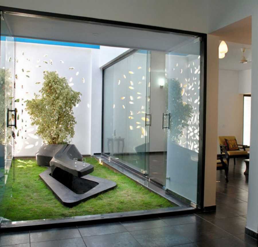 eco friendly house design with indoor garden using glass wall