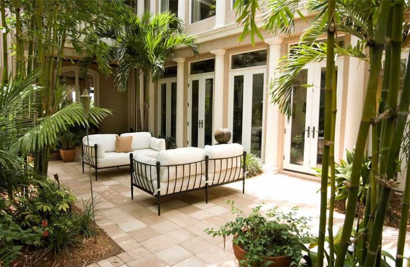 outdoor living room design with bamboo plants in garden