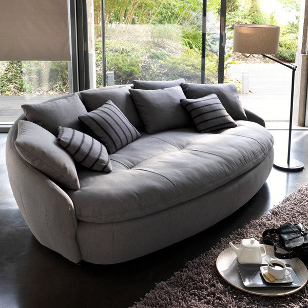 contemporary sofa with round shapes and soft upholstery fabric