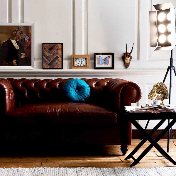 chesterfield sofa in brown color with turquoise cushion for traditional living room designs
