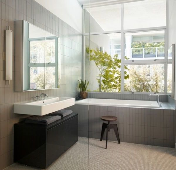 Compact white floating sink set in the bathroom of a modern loft