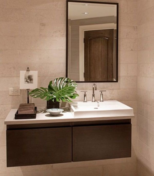 Sporadic presence of natural green to liven up the floating sink cabinet