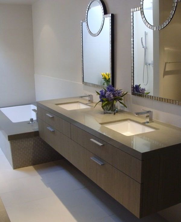Tantalizing bathroom design with beautiful mirrors and brown floating sink