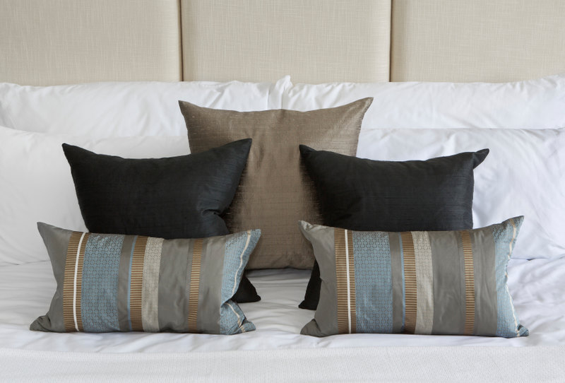 An experiment in symmetry demonstrates how thoughtfully arranged accent pillows can make a real impact within any decor.