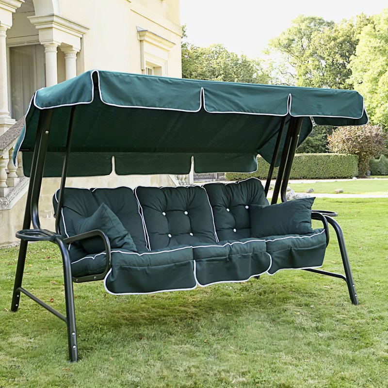 outdoor cushions and canopy on green lawn grass at front yard