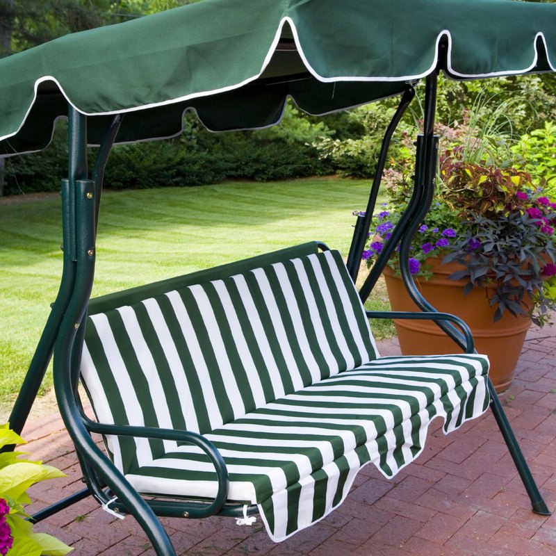 Featuring Striped Patio Swing Set With Canopy On Stone Tile Patio Paired With Potted Flower Plant