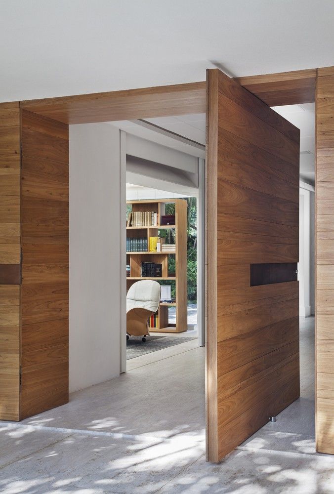 Gorgeous wood pivot entry door