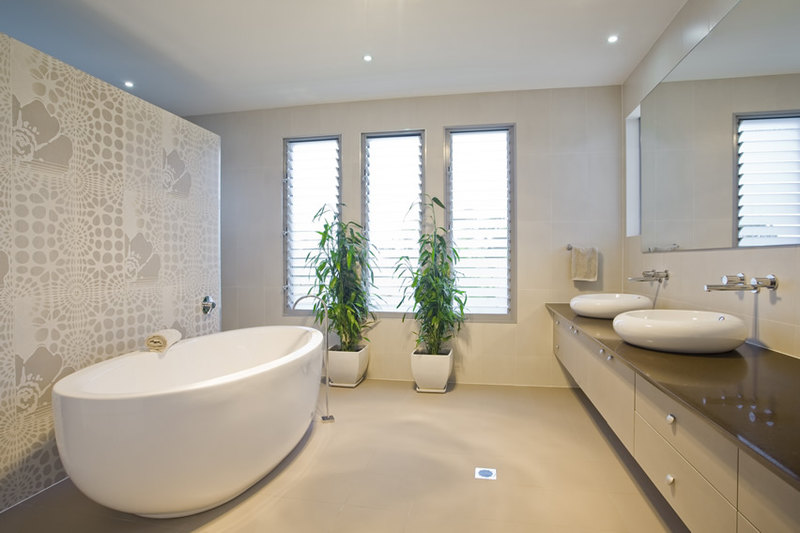 Modern bathroom design with very unique accent wall and freestanding bathtub