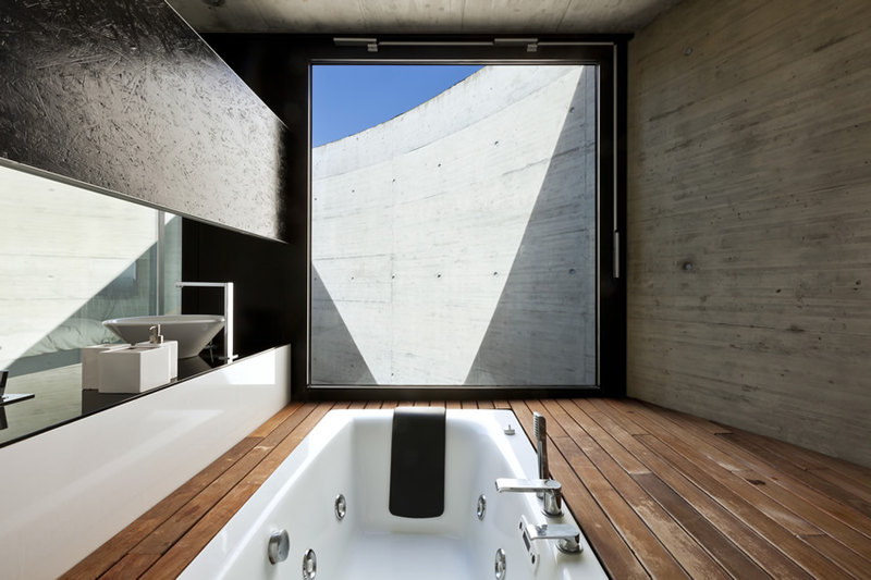 Minimalist bathroom design with floors of cherry finished treated wooden planks