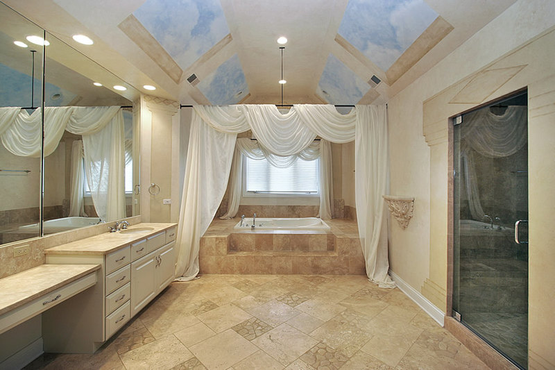 Bathroom uses mix-sized ceramic tiles for its floors, with accents of faux natural-cut stone tiles Bathroom uses mix-sized ceramic tiles for its floors, with accents of faux natural-cut stone tiles