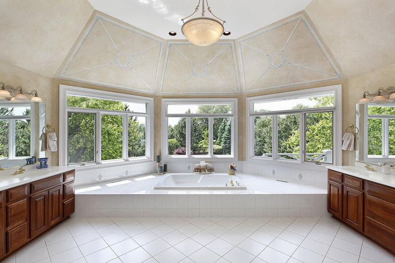 Roomy custom bathroom design which uses white 30x30 ceramic tiles in a diagonal layout