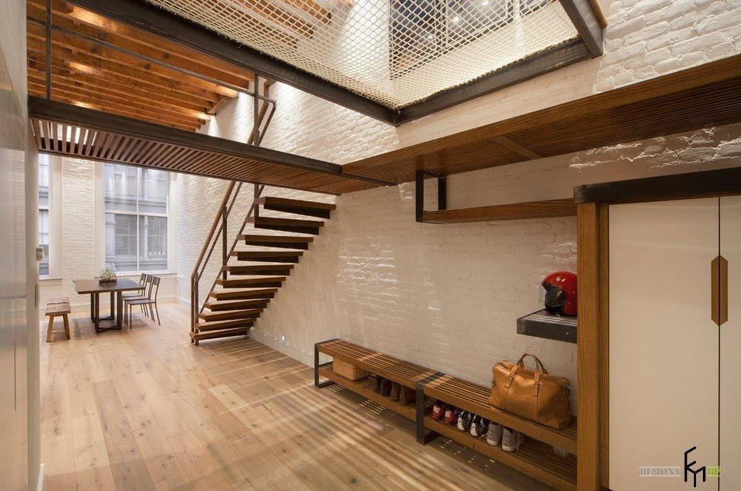 a charming hallway with cedar wood flooring and exposed white brick wall idea