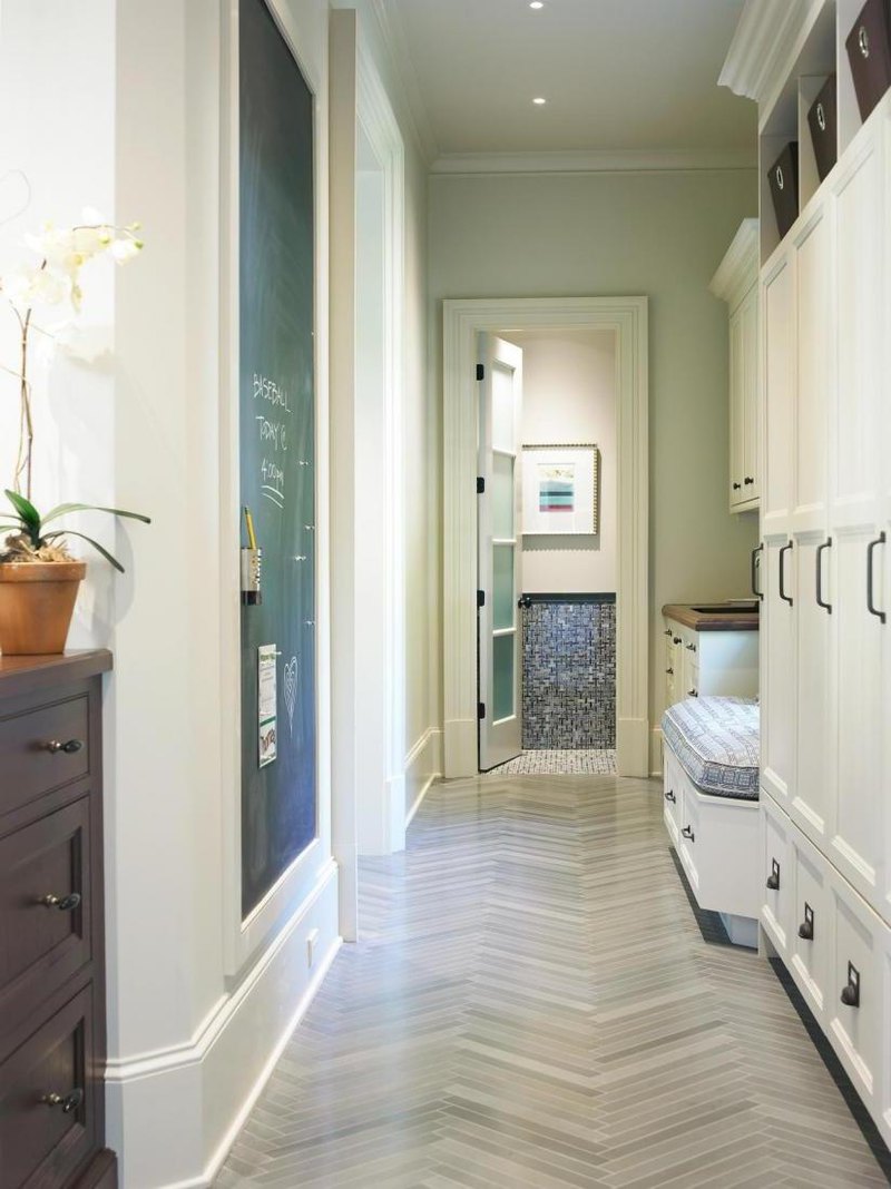 Narrow hallway with white storage and simply bench also big chalkboard with bright lamps and chevron floor design Easy Hallway Organization with Mudroom Furniture Ideas
