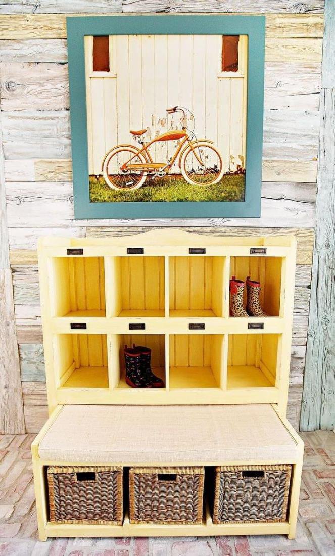 Simply DIY wooden shoe storage bench with cushion and rattan baskets under a small window at the hallway space