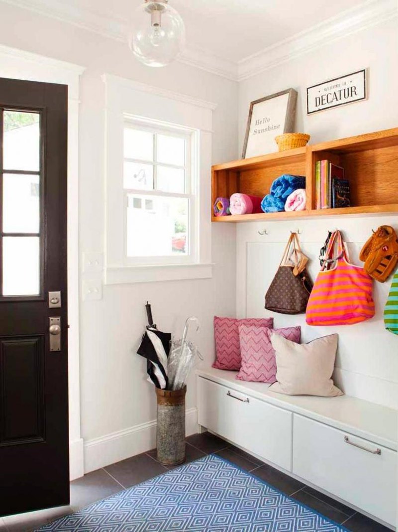 Simply wooden shelves and white storage bench along with small pillows and wall hooks decorated by lovely bulb and rug Easy Hallway Organization with Mudroom Furniture Ideas