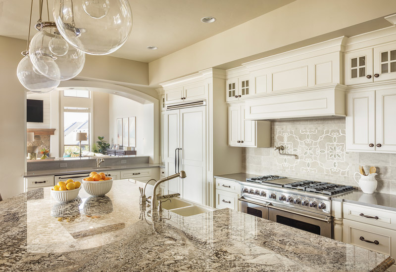 Kitchen with Island, Sink, Cabinetrs, and Hardwood Floors