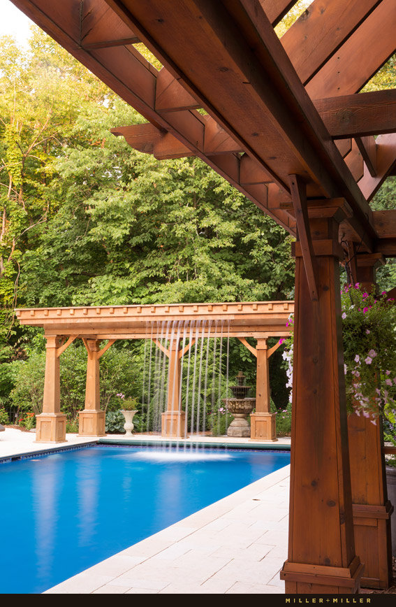 pergola cascading waterfall into pool