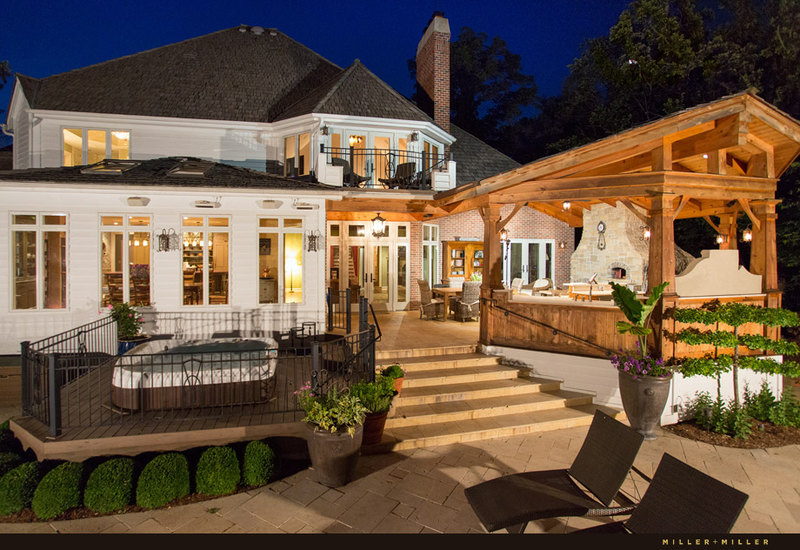 custom home backyard stone marble patio hot tub