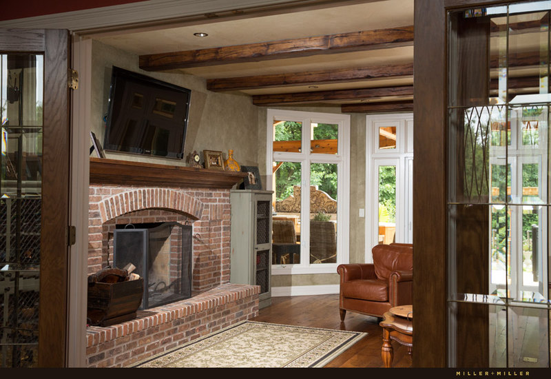 family room brick wood burning fireplace reclaimed beams ceiling