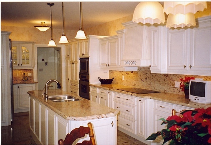 Kitchen cabinets with granite countertops and stainless steel vanity