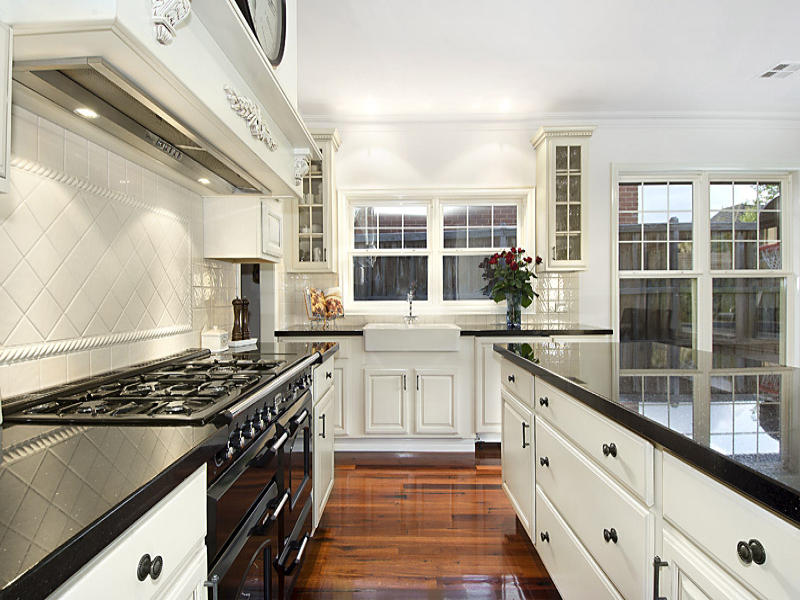 classic galley kitchen with high gloss countertop