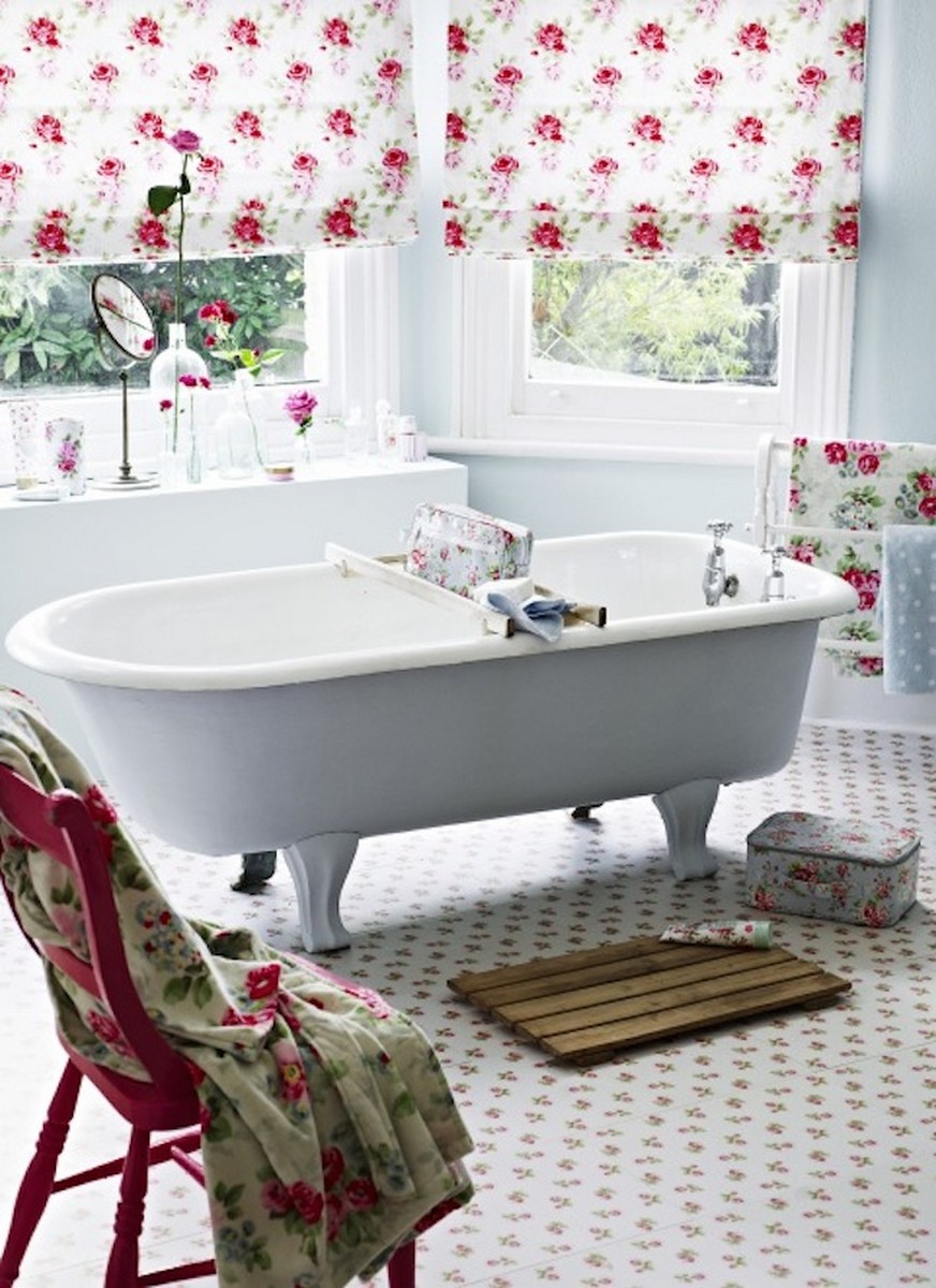 eclectic-bathroom-with-white-standalone-bathtub-and-vintage-red-chair-also-floral-curtain-and-floor-tile