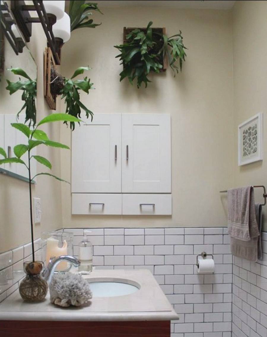 Vintage bathroom with white tile wall coupled with a tall potted plant on the vanity Vintage-Echo-Park-bathroom-with-white-tile-wall-coupled-with-fabulous-Elkhorn-Fern-and-a-tall-potted-plant-on-the-vanity