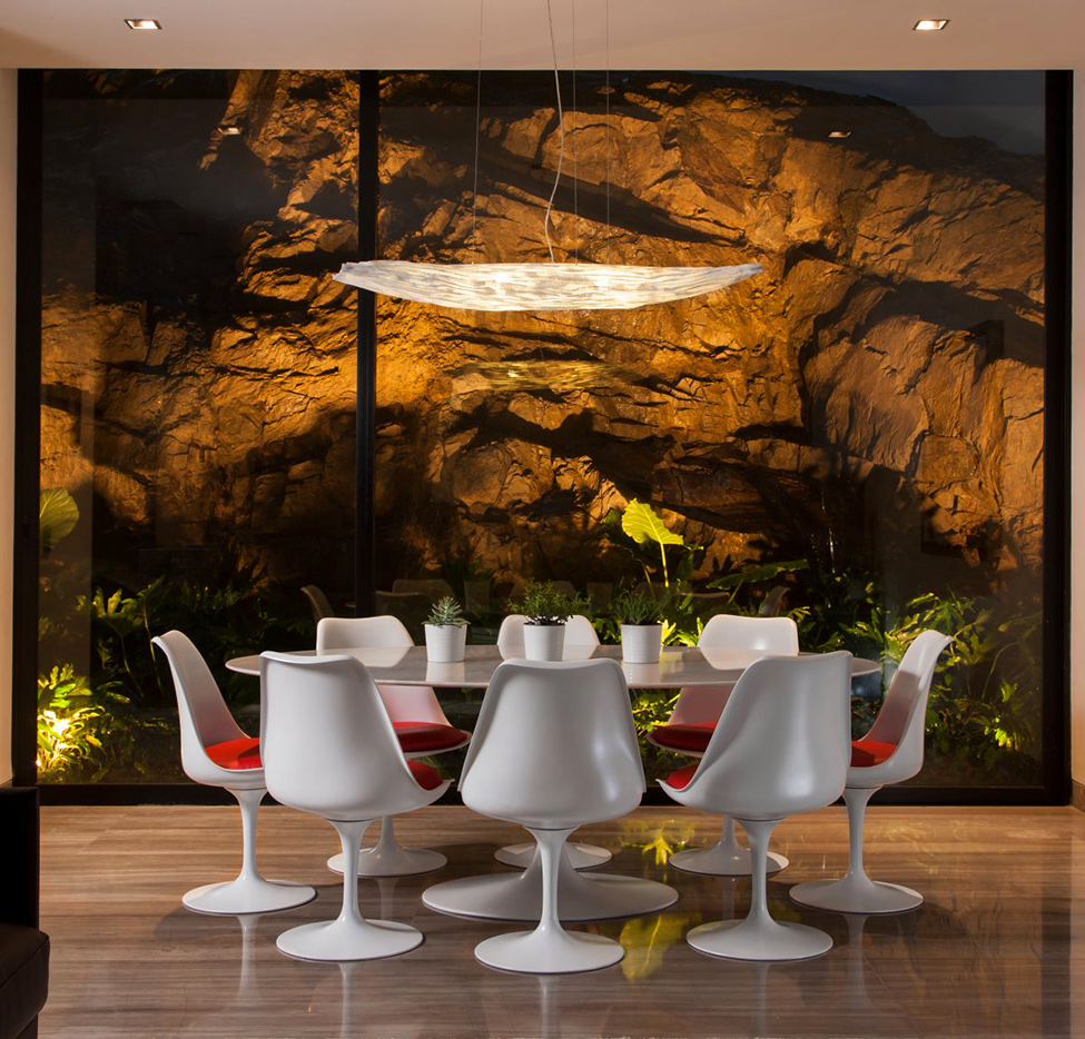 Table and stone wall Luxury Home in Mexico Providing High Quality Lifestyle 