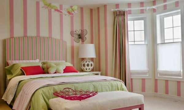 Stripes wall behind bed headboard bed pink butterflies green